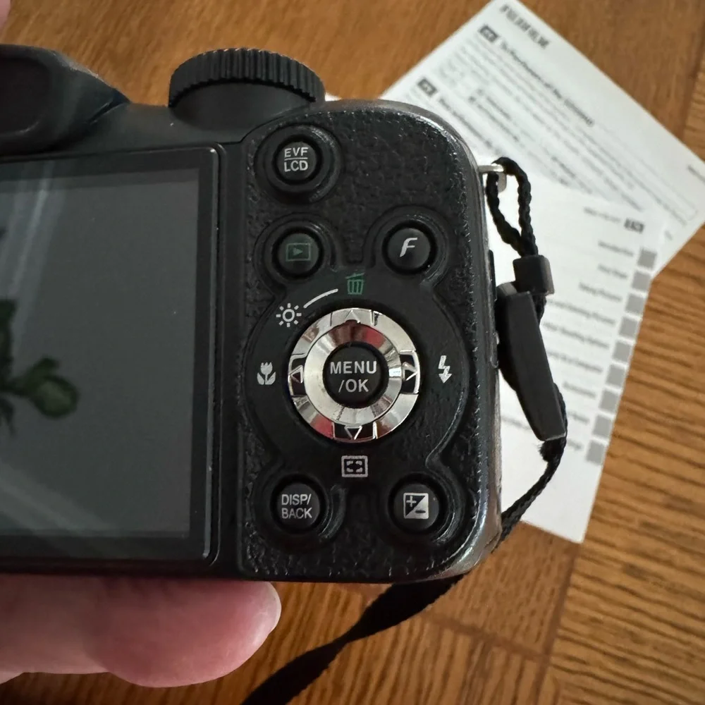 Fujifilm Black Digital Model S2550HD Camera with Zoom Lens and Ergonomic Grip.